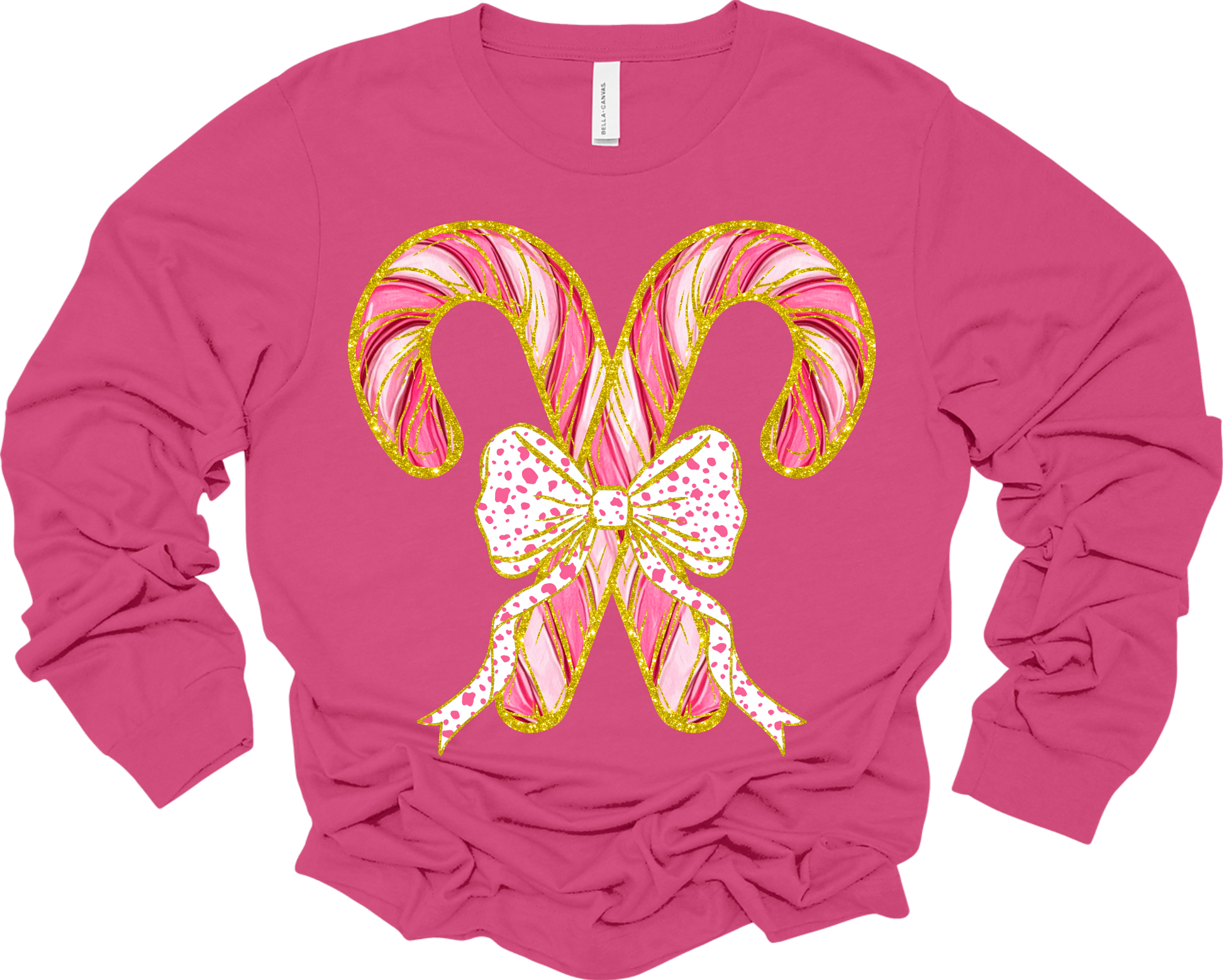 Long sleeve pink t-shirt with two criss crossed candy canes outline in faux gold glitter with a polka dot bow image.